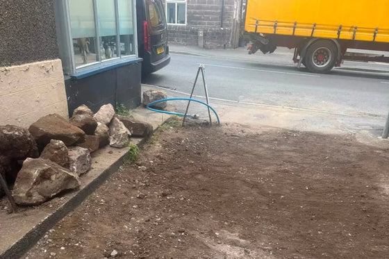 New water main run up to a property before the ground is reinstated