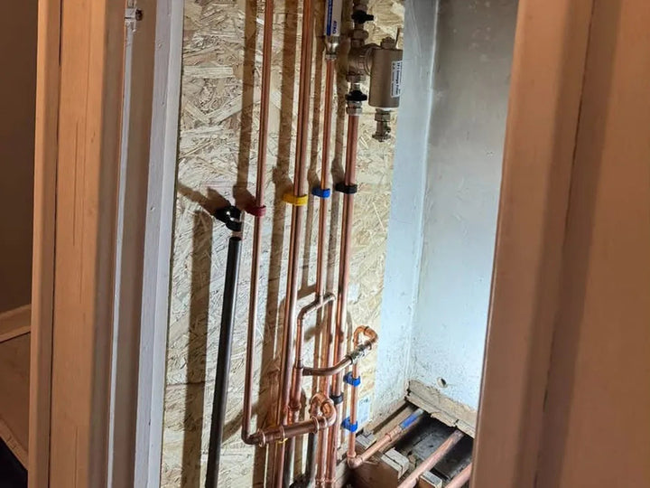 Airing cupboard pipework and copper manifold reworked