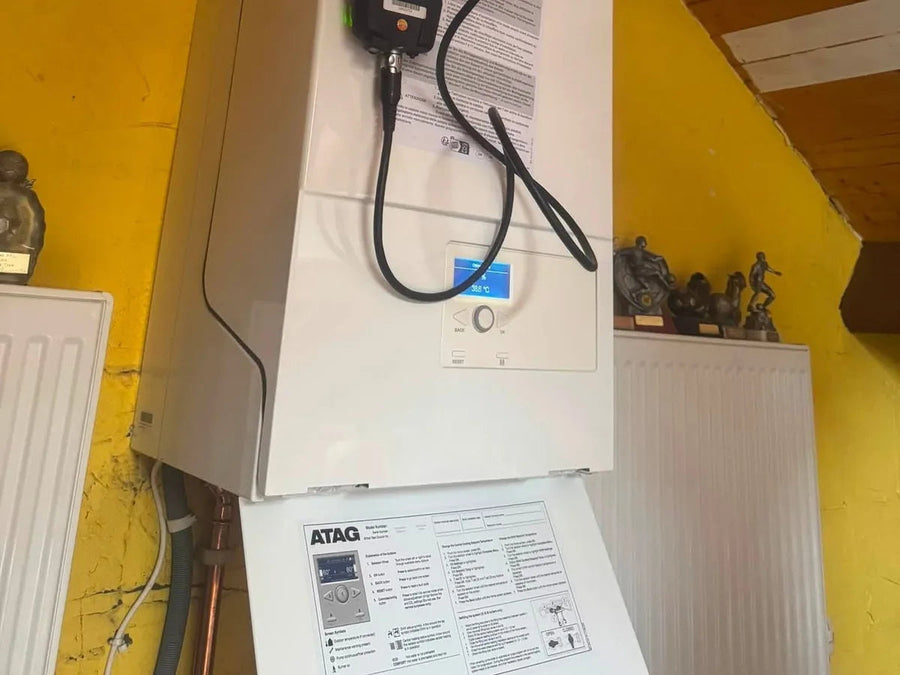 Flue gas analyser connected to a boiler during commissioning by Axio Gas