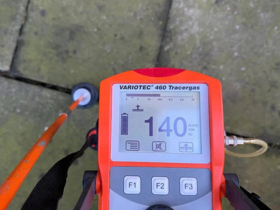 Tracer gas detector reading taken while pinpointing a water leak